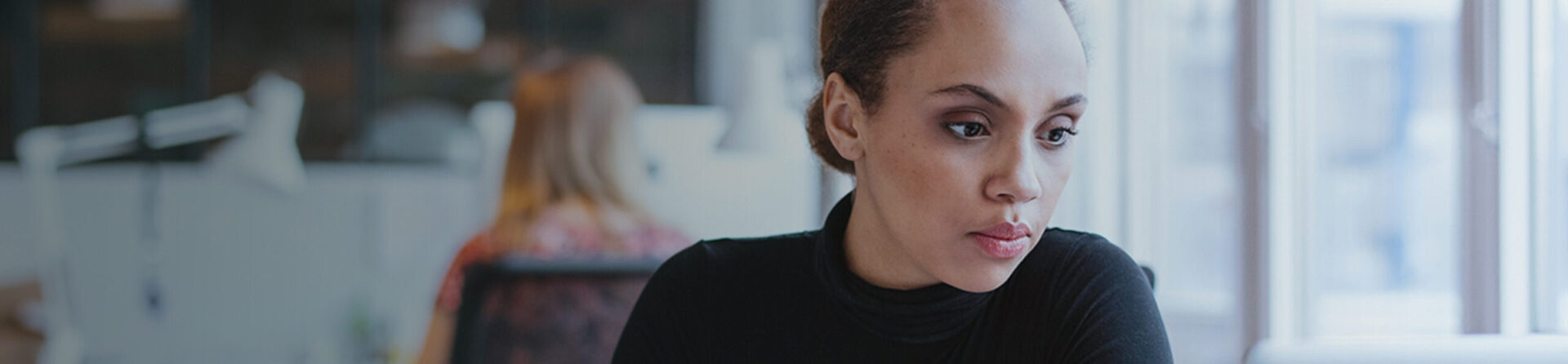 Young black woman in office.